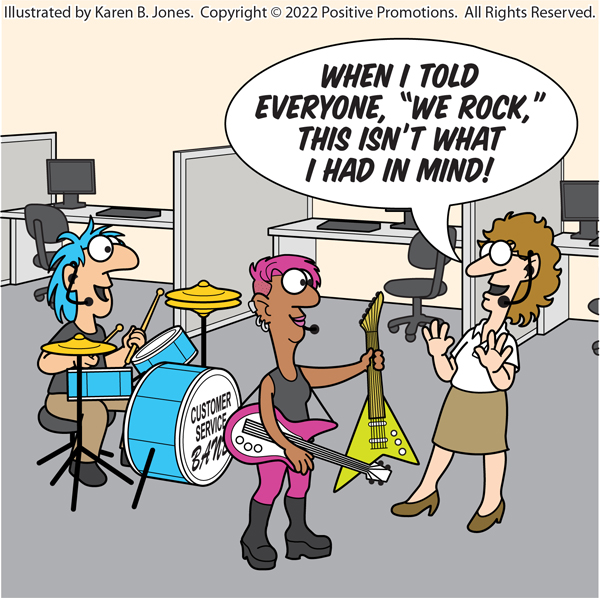 In front of a row of office cubicles, two people dressed as rock stars seem prepared to perform.  One is sitting at a drumset.  The other is holding a bass guitar and offering a standard guitar to a woman dressed as a drab office worker.  The non-rocker has her hands up in a negating gesture and says, "When I told everyone, 'We Rock,' this isnt' what I had in mind!"